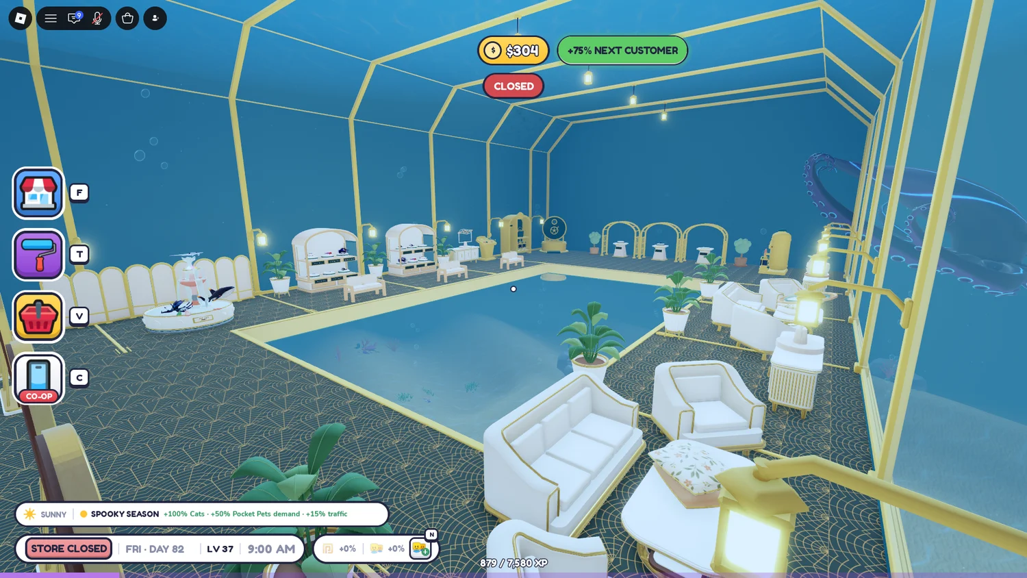 A tall blue marine room with gold trim, white seating and displays around the perimeter.