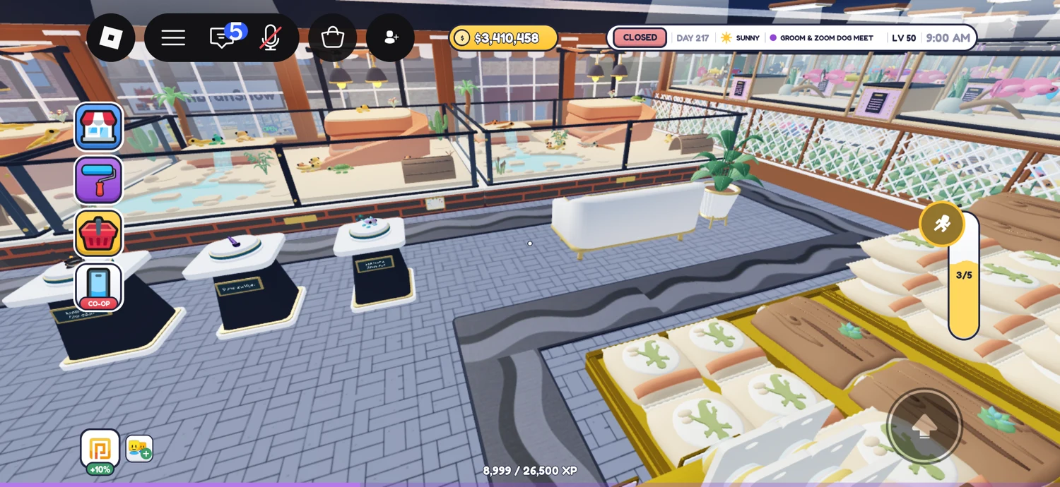 Glass-fronted animal displays beside a blue brick-pattern aisle, pet beds and potted plants.