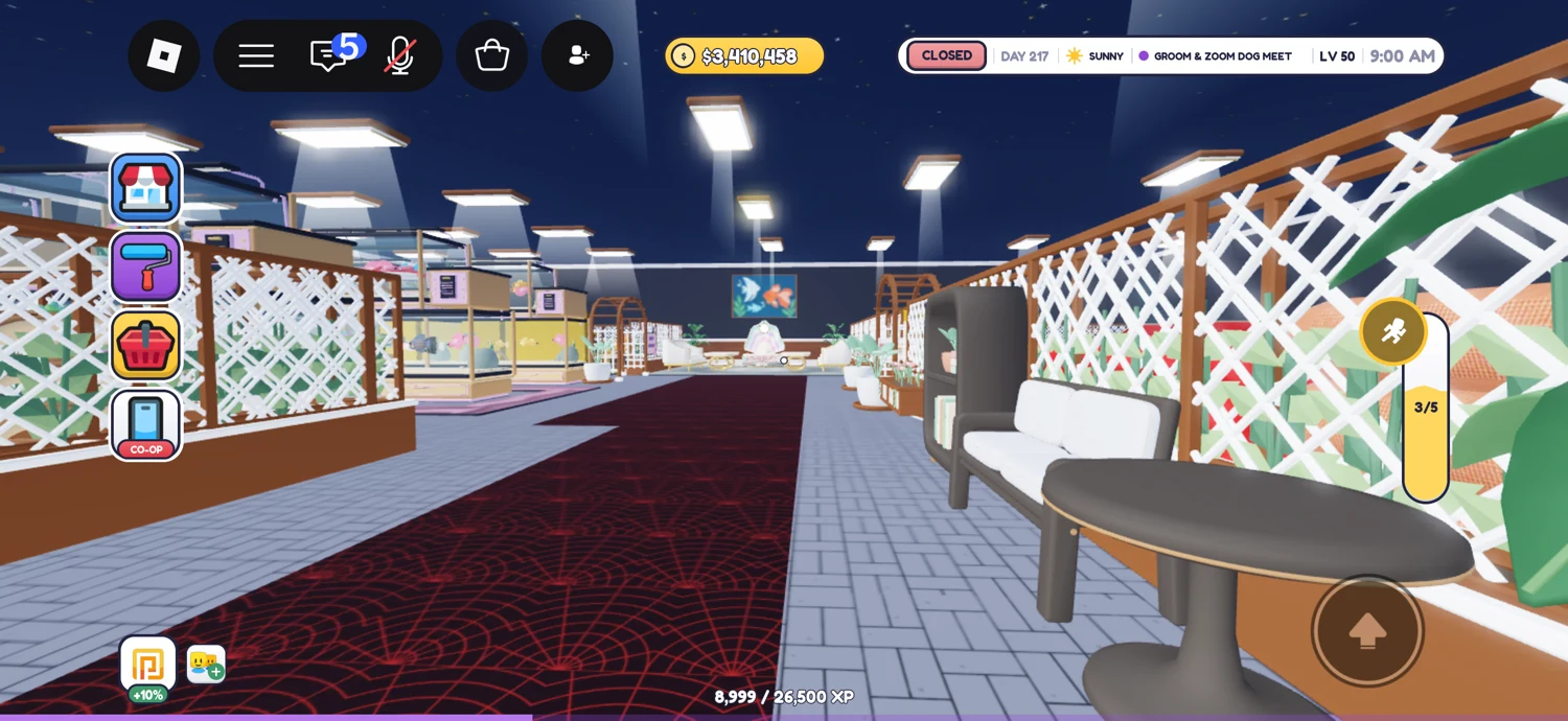 Long aisle with flowering white trellises, seating and a dark red patterned runner.