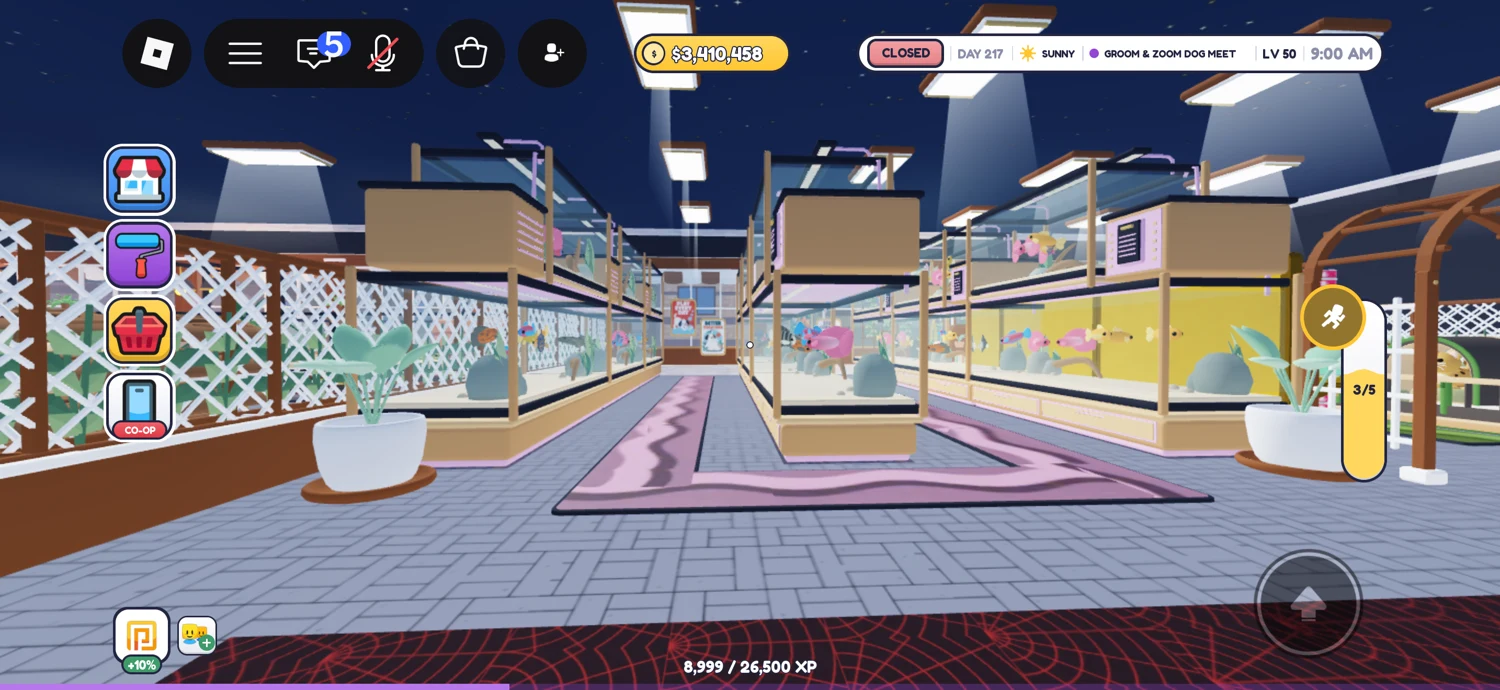 Rows of glass-fronted displays along a pink-trimmed aisle beneath bright ceiling lights.
