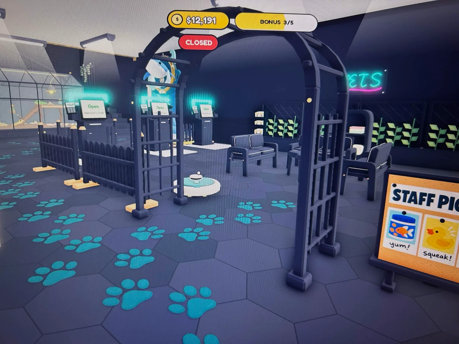 A dark arched entrance with teal paw prints leading into a seating corner beside neon signs.