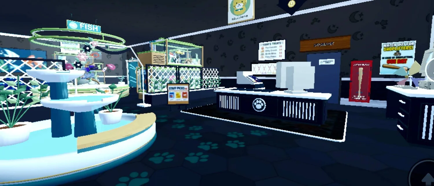 Dark checkout counters with white trim beside a glowing round display and teal paw-print floor accents.