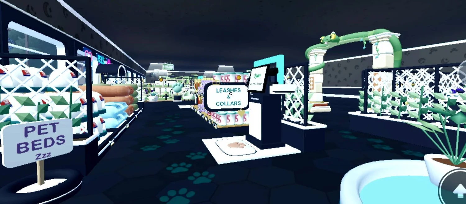 A dark aisle with paw prints, merchandise signs and white trellis dividers.