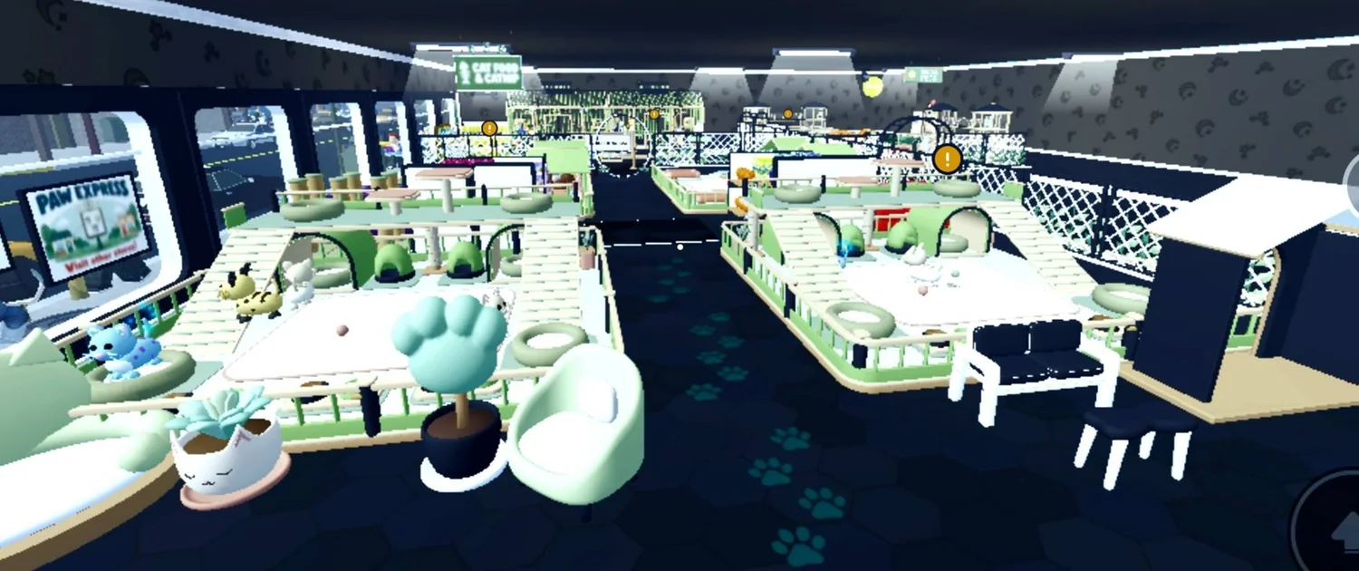 Mint animal enclosures arranged in rows beside a pale chair and planter.
