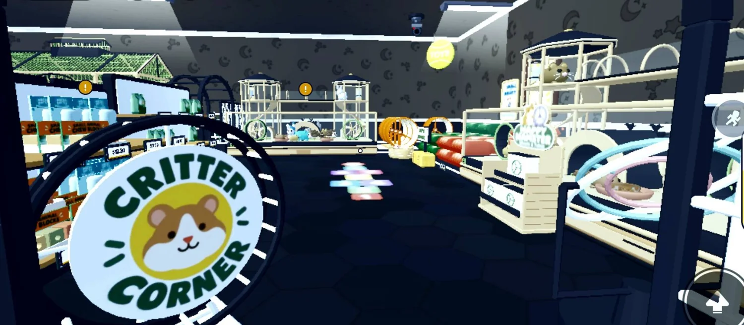 A Critter Corner sign beside small-pet enclosures and colourful floor accents.