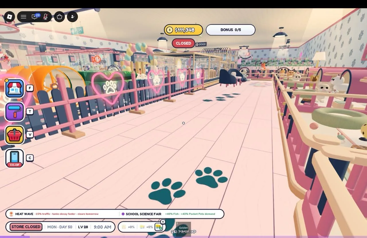 A long pink-floor aisle with dark paw prints, neon heart decorations and animal enclosures on both sides.