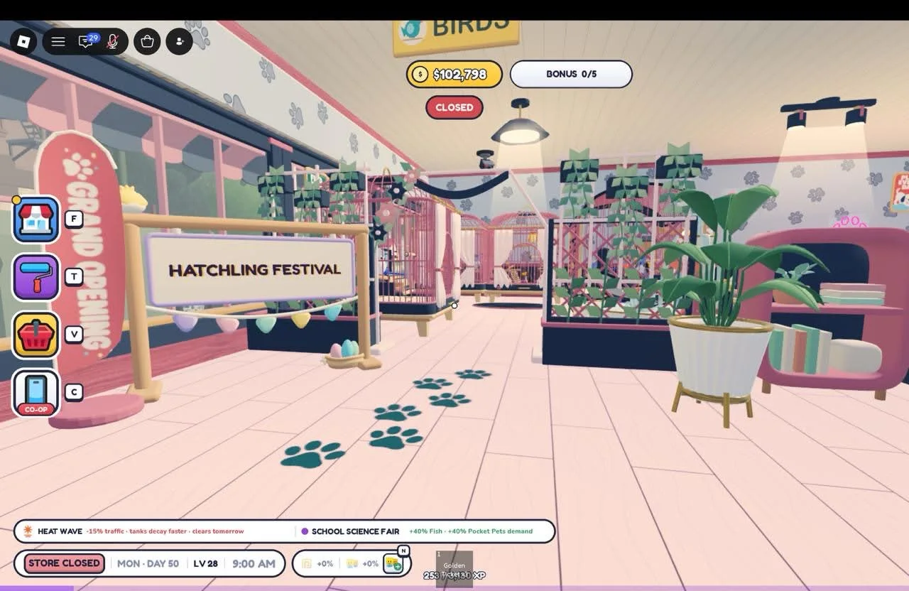 Bird-area entrance with planted pink trellises, tall cages and a Hatching Festival board.